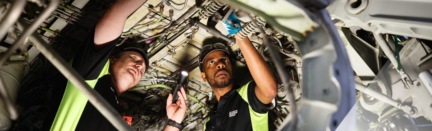 Atlantic Aviation Group employees working on an aircraft