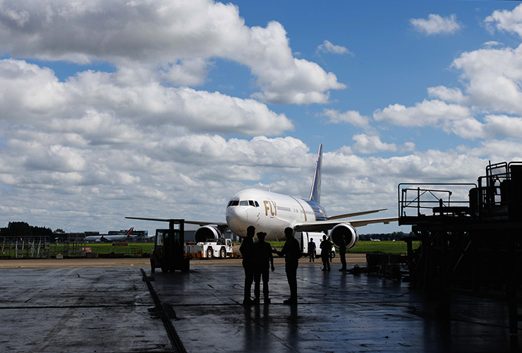 Atlantic Aviation staff working outside hanger on a runway