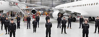 Atlantic Aviation Group team members in hanger